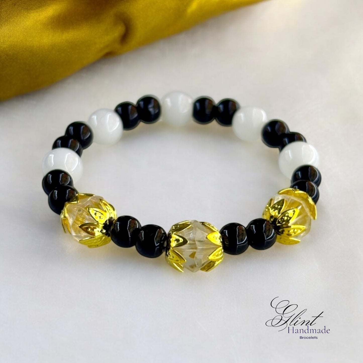 Black and White Bead Bracelet with Gold Floral Accents