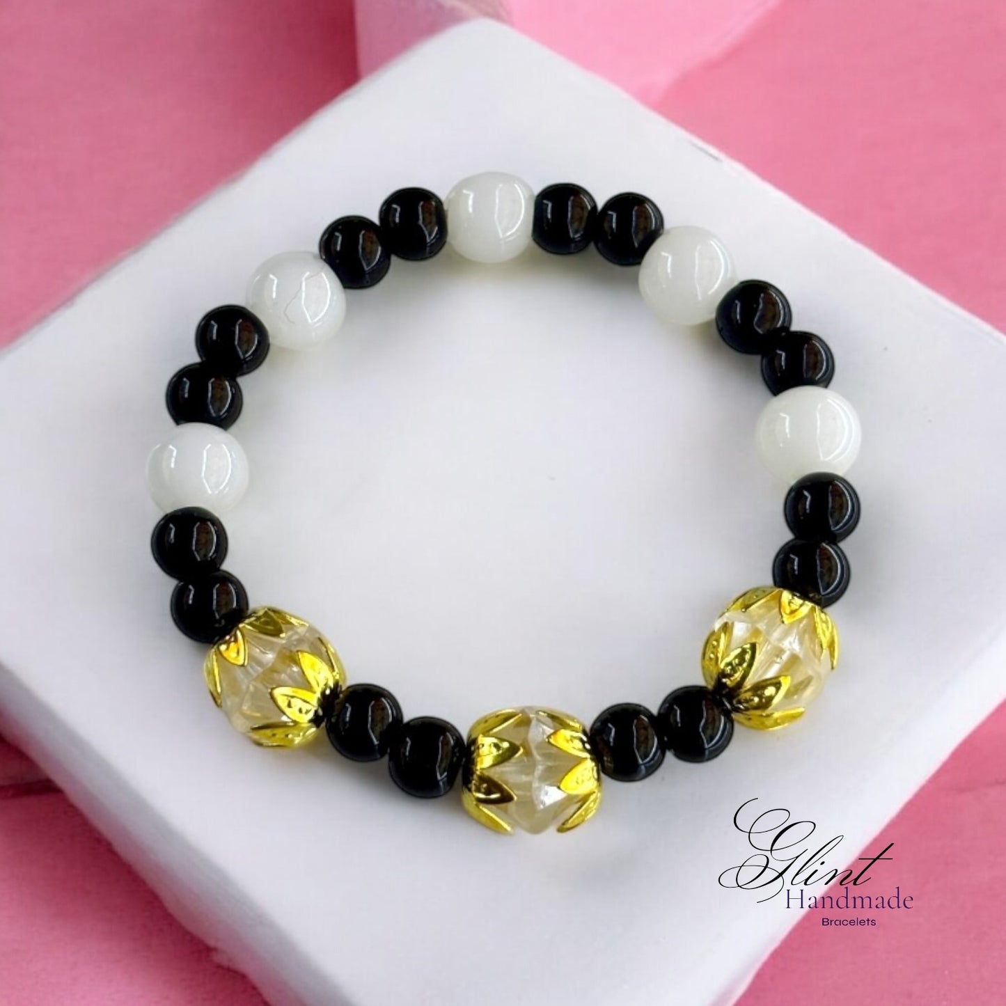 Black and White Bead Bracelet with Gold Floral Accents