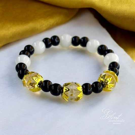 Black and White Bead Bracelet with Gold Floral Accents